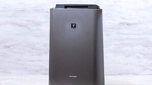 A tall, rectangular air conditioner unit with a metallic finish and a logo on the top. - Sun Hotel Fukuyama (Fukuyama)