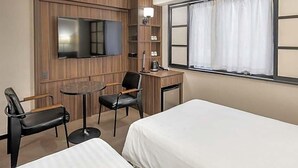 A hotel room with two beds, a desk, a chair, a TV, and a window with curtains. - Sun Hotel Fukuyama (Fukuyama)