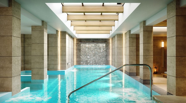 A modern indoor pool with clear water, a metal ladder, and a waterfall feature. - Electra Kefalonia Hotel and Spa (Kefalonia)