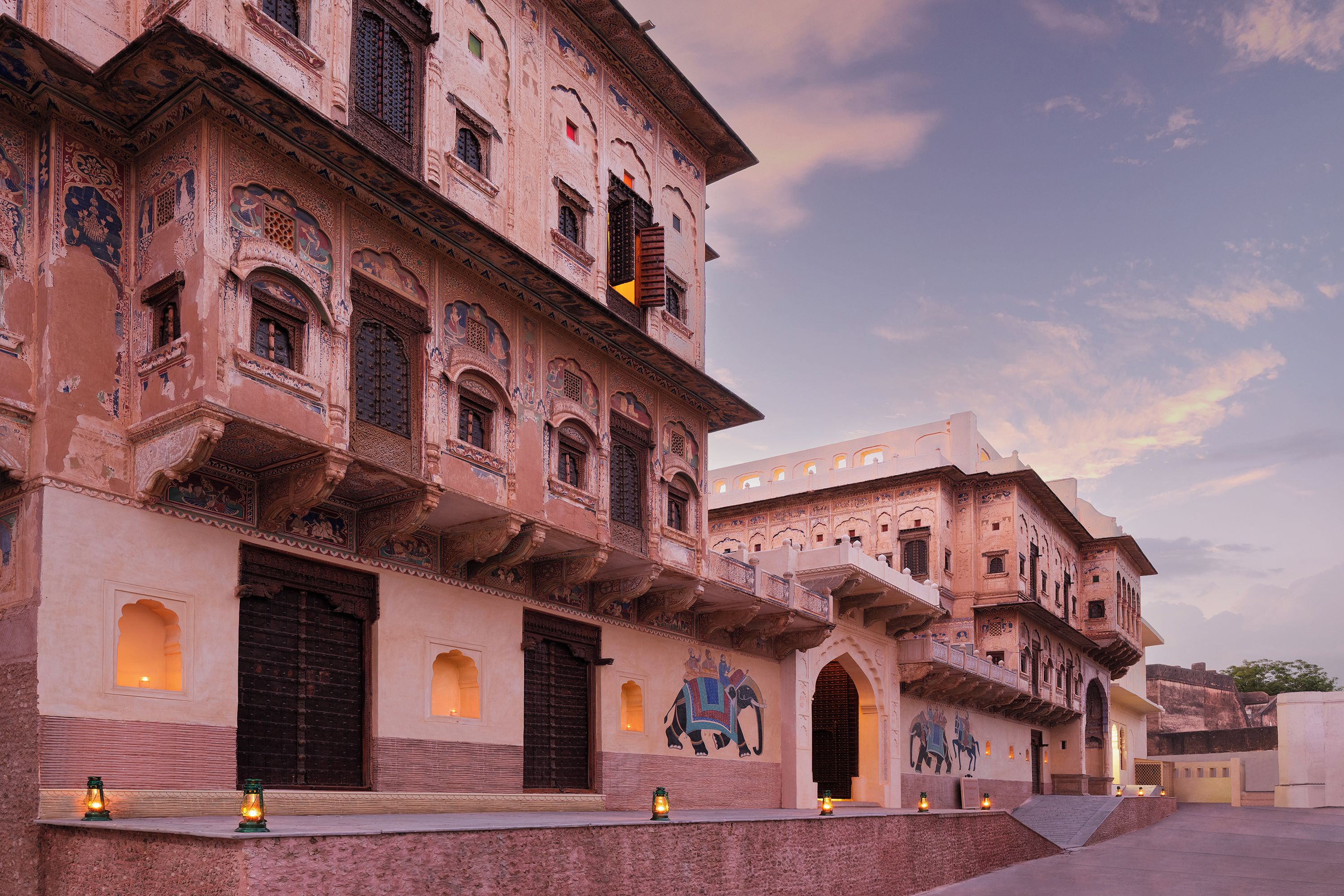 A traditional building with multiple balconies and arched windows.