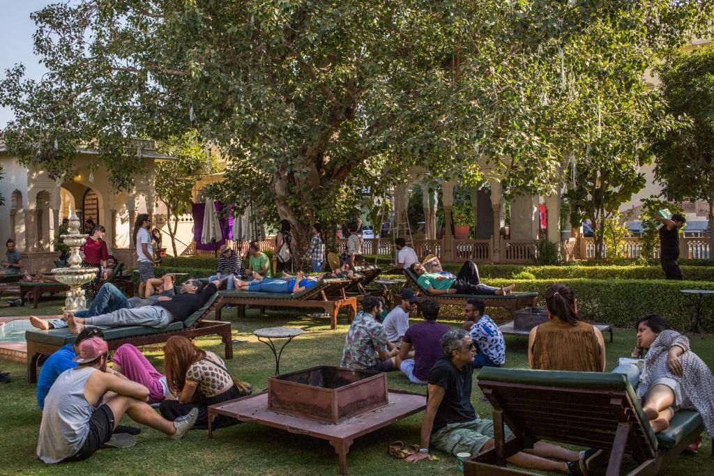 A courtyard with outdoor seating, a fire pit, and a fountain.