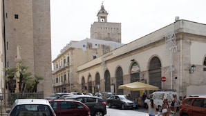 A historic building with arched windows and a tower. - Ad Calcem "lagodentro" (Terlizzi)