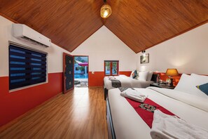 A hotel room with a wooden ceiling, a bed with white linens, a red accent wall, and a window with blinds. - Cat Ba Serena Homestay And Swimming Pool (Cat Hai)
