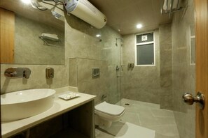 A modern bathroom with a large sink, mirror, and shower. - Hotel Sakura By Maps, Huda City Center (Gurugram)
