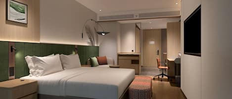 Une chambre d’hôtel moderne avec un grand lit, des tables de chevet, un bureau et une télévision.