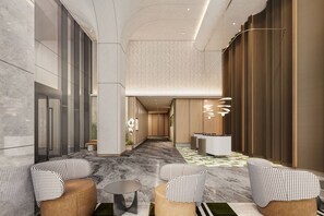 En modern entréhall med ett marmorgolv, stolar med ett rutmönster i form av hundtandsmönster, en receptionsdisk och en mönstrad matta.