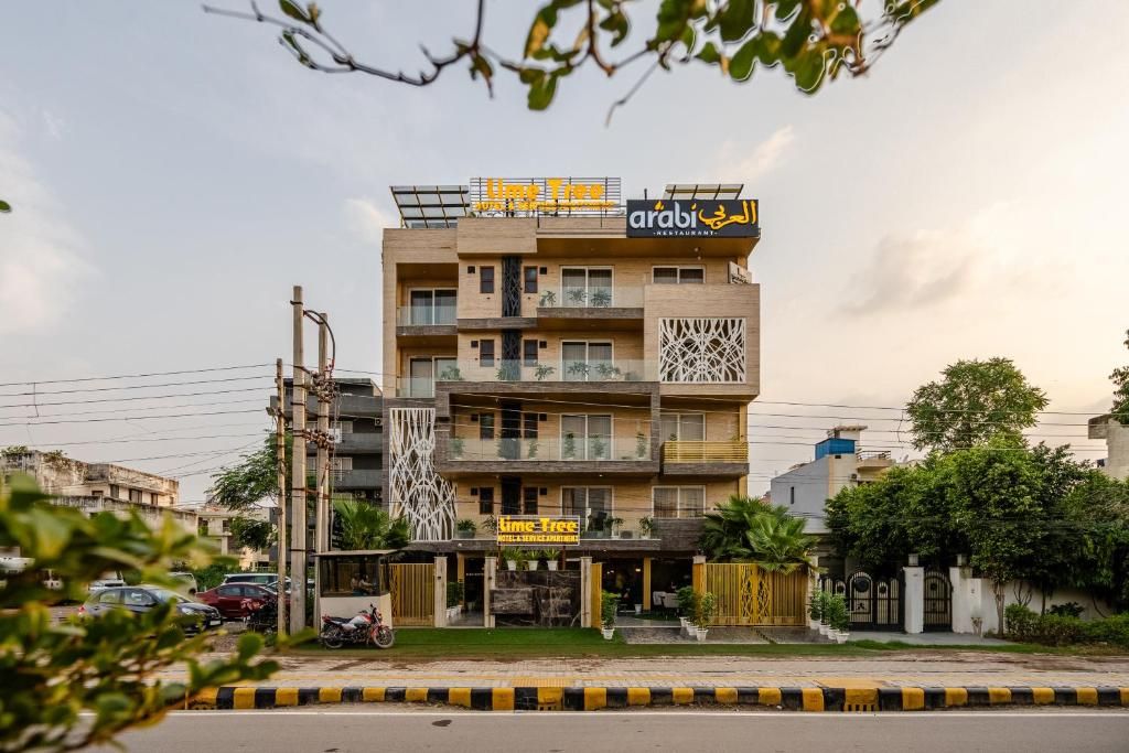 A multi-story building with balconies, a sign for 'arabi restaurant', and a 'Time Free' sign below.