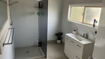 Shower, hair dryer, towels, soap