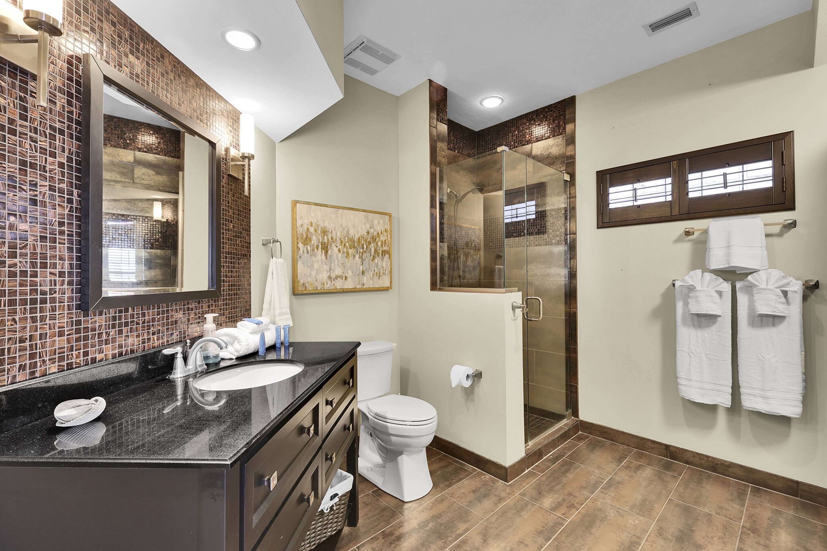 Shower, hair dryer, towels, shampoo