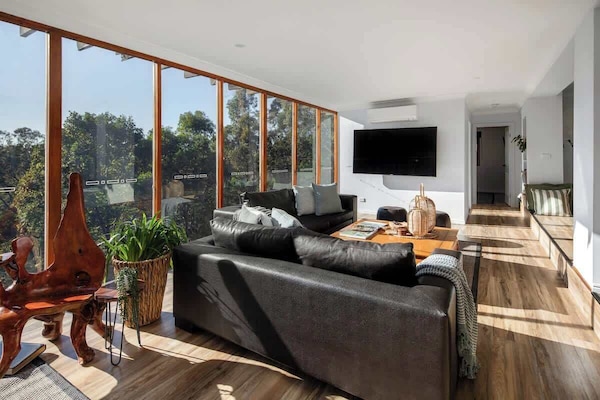 TV big enough to satisfy the screen-lovers. Forest views bold enough to convince them to look up.