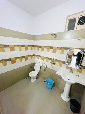 Shower, rainfall showerhead, slippers, towels