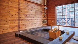 A wooden interior with a tatami mat room, a wooden bench, and a window with a view of trees. - rinne 2nd living Nasu Garden (Nasu)
