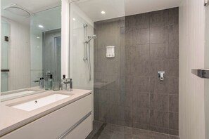 Shower, hair dryer, towels, shampoo