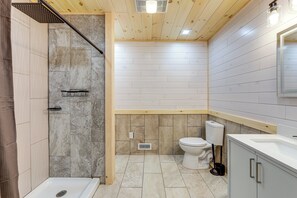 A modern bathroom with a shower, toilet, and sink. - Direct Trail Access: Lyons Falls Getaway w/ Views! (Lyons Falls)
