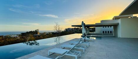 Outdoor pool, pool umbrellas, pool loungers