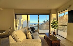 Deluxe Apartment, 2 Bedrooms, Partial Ocean View | Living area - Oceanview Condo CaboCosta Balandra (Cabo San Lucas)