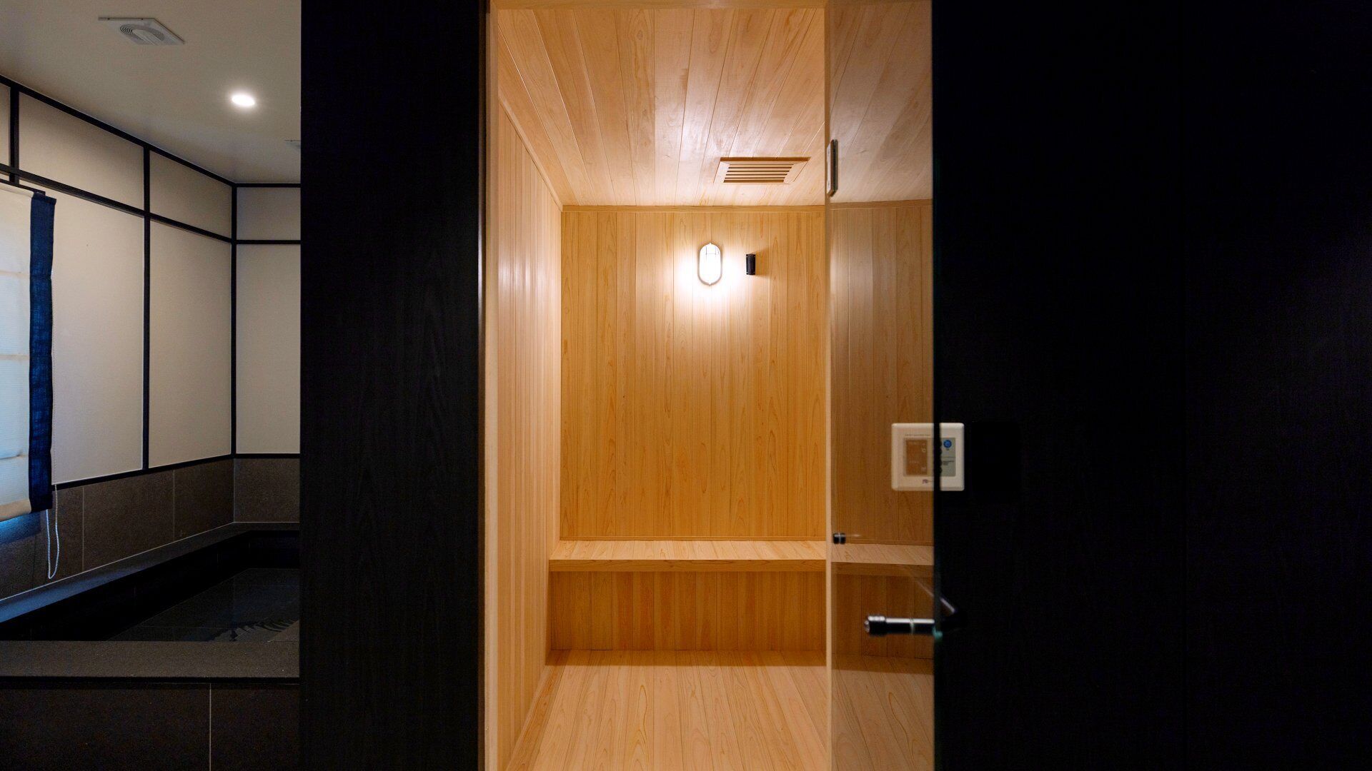 A modern elevator with wooden paneling and a control panel.