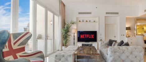 Appartement, uitzicht op de stad | Woonruimte | Flatscreentelevisie