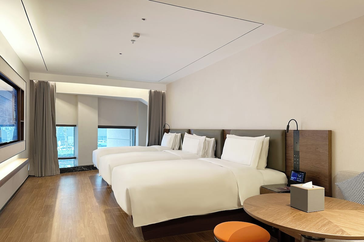 Family Room | Free minibar, in-room safe, blackout drapes, free WiFi