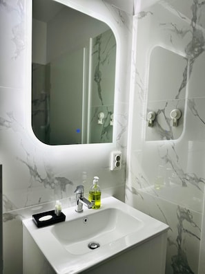 Hair dryer, towels, soap, toilet paper