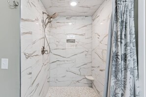 Shower, hair dryer, towels, shampoo