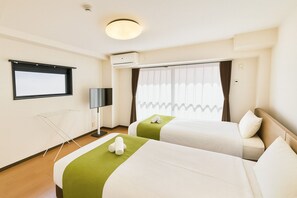 A hotel room with two beds, a flat-screen TV, an air conditioning unit, and a window with curtains. - Casa G.S. Ebisucho (Osaka)