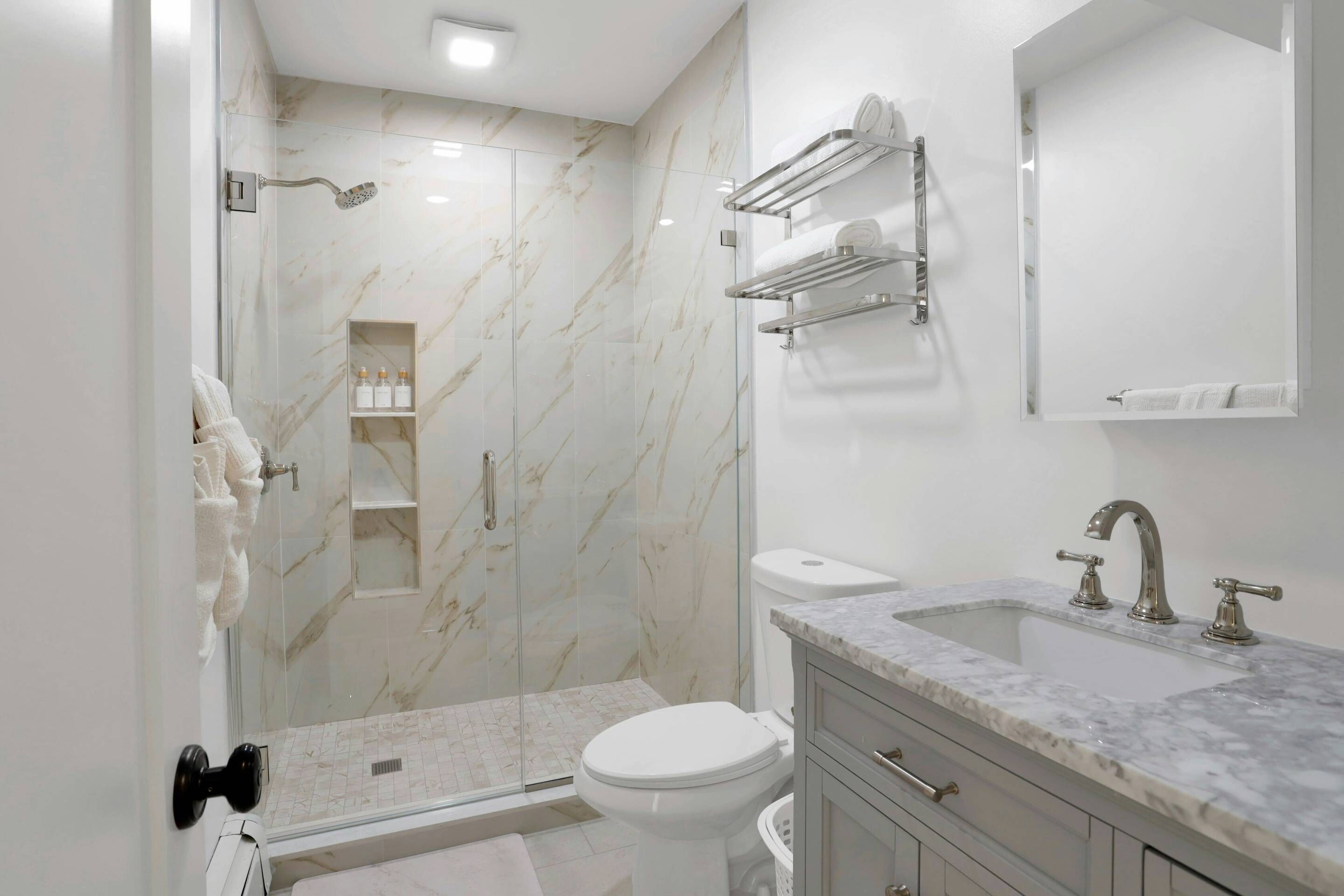 Shower, hair dryer, towels, shampoo