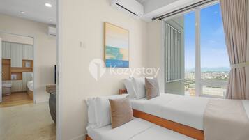 Apartment, 2 Bedrooms, City View | Desk, laptop workspace, iron/ironing board, free WiFi