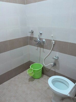 Shower, rainfall showerhead, slippers, towels