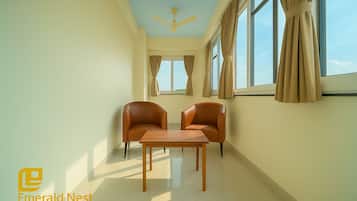 Suite, Balcony | Living area | 32-inch Smart TV with digital channels, streaming services