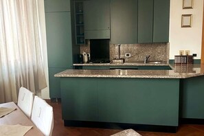 Microwave, stovetop, toaster, dining tables