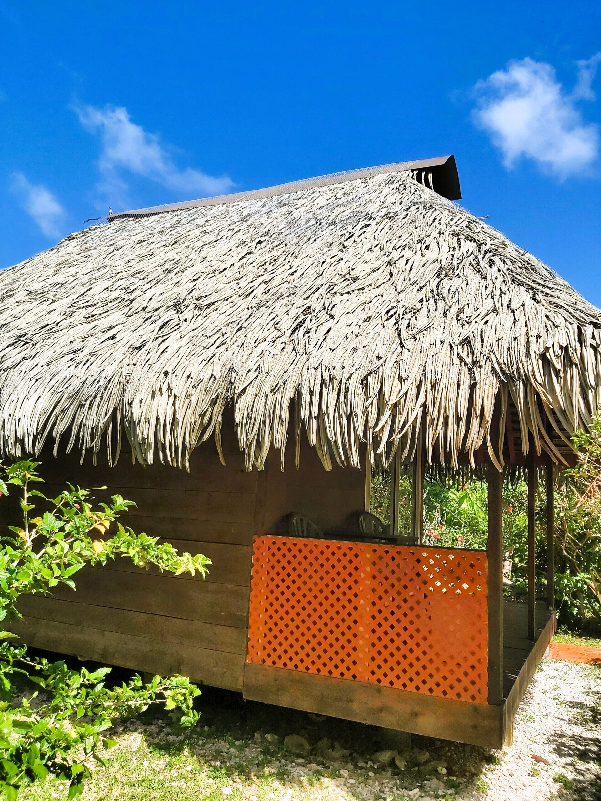 Typical Polynesian bungalow with traditional roof