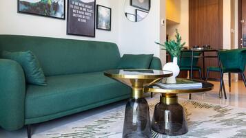 Deluxe Apartment, 1 Bedroom, Non Smoking | Living area | 65-inch flat-screen TV with satellite channels