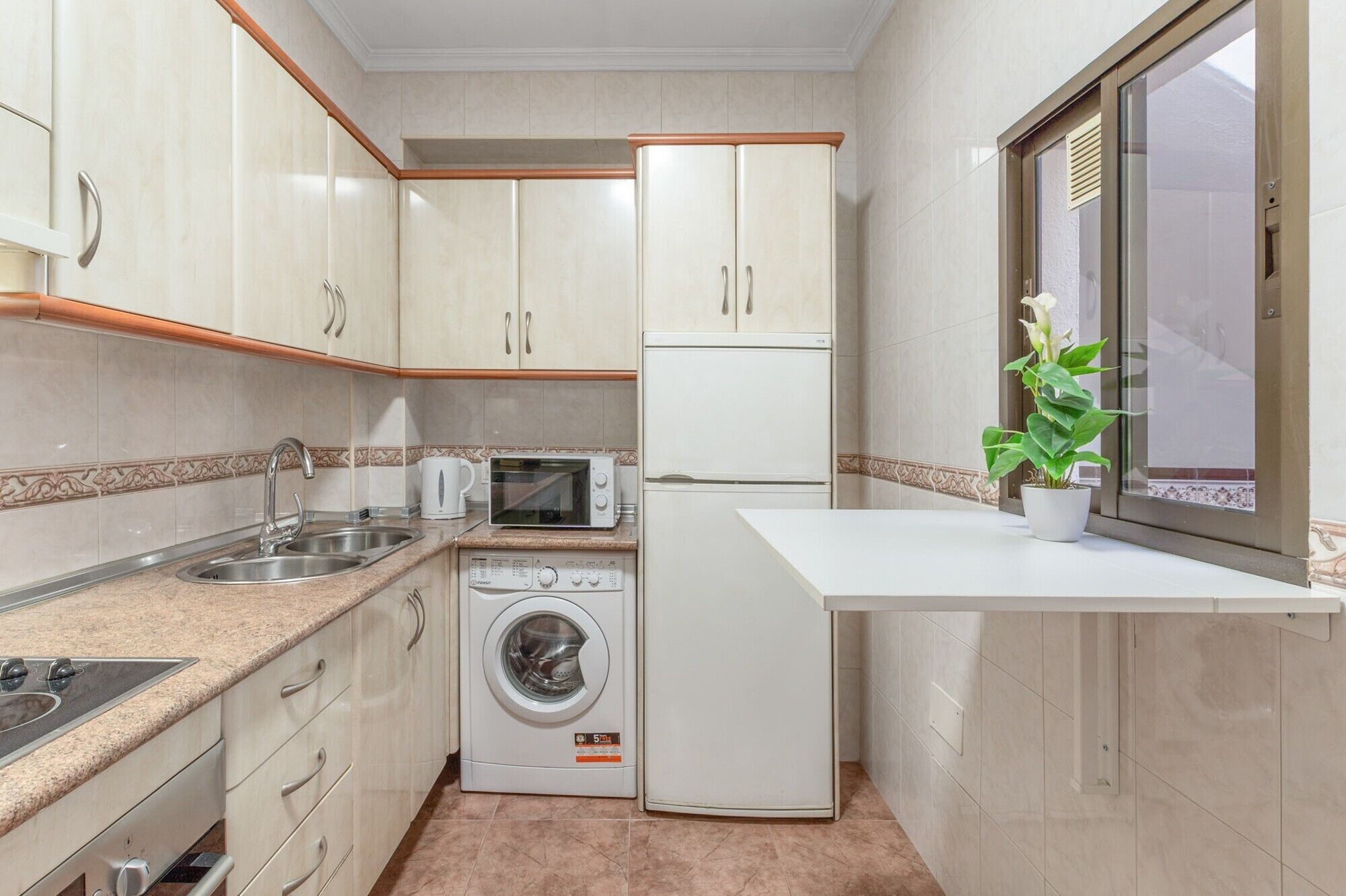 Microwave, oven, coffee/tea maker, cookware/dishes/utensils