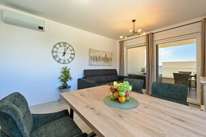 Deluxe Apartment, Balcony, Partial Sea View | In-room dining