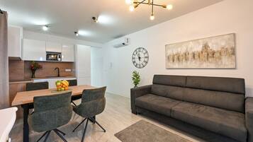 Deluxe Apartment, Balcony, Partial Sea View | In-room dining