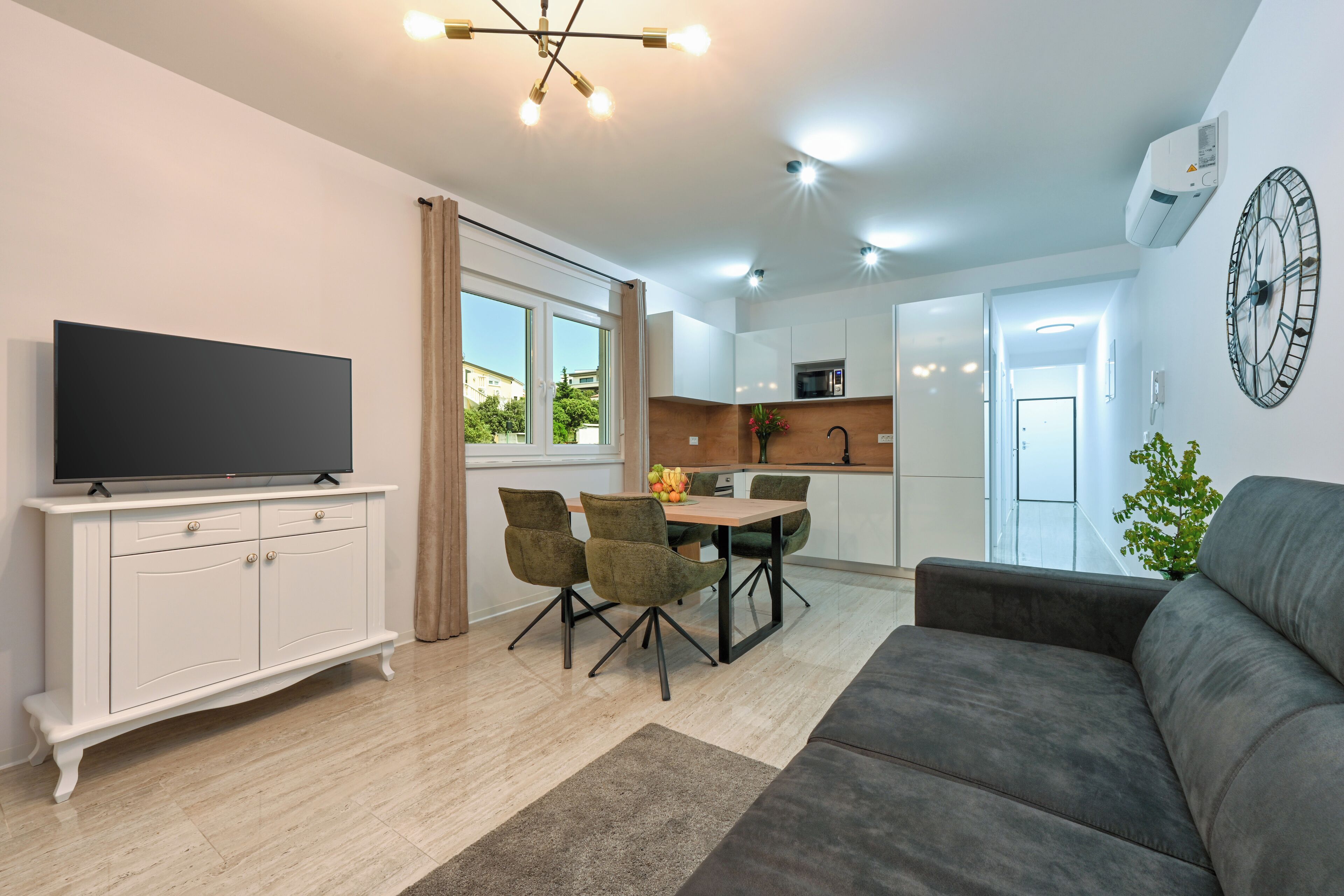 Deluxe Apartment, 2 Bedrooms, Partial Sea View | Living area | 10-cm TV with satellite channels