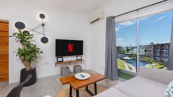 Comfort Apartment, Sea View | Living area | 55-inch LCD TV with digital channels, Netflix, streaming services