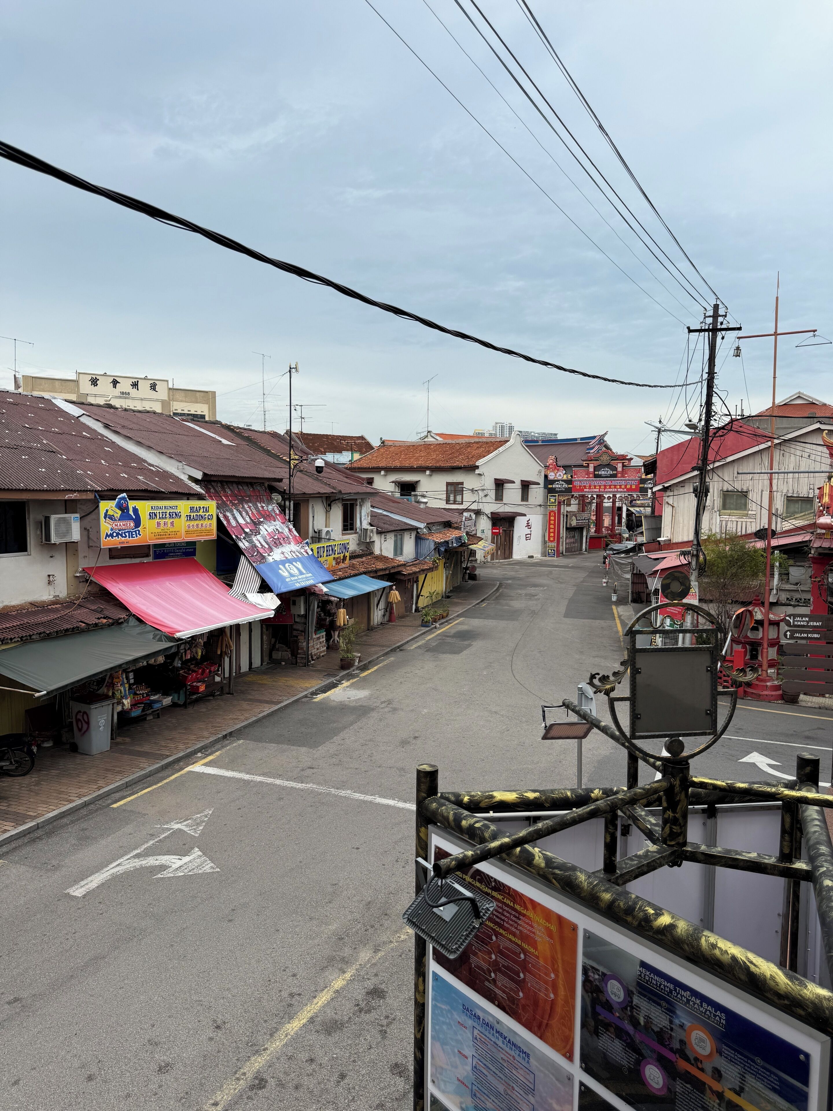 A street view with various shops and buildings, including a sign for 'KIRIN BISTRO' and a 'MONSTER' sign.