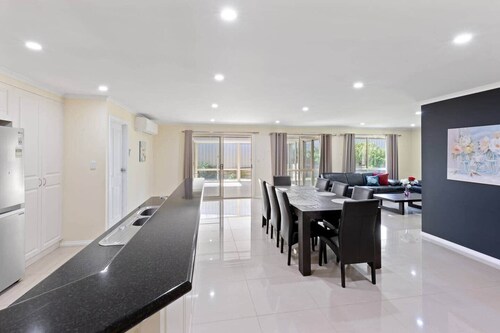 Comfortable 4-Bedroom Home with Backyard Escape