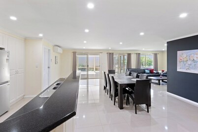 Comfortable 4-Bedroom Home with Backyard Escape