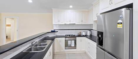 Microwave, stovetop, dishwasher, cookware/dishes/utensils