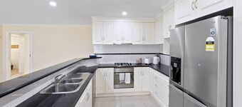 Comfortable 4-Bedroom Home with Backyard Escape