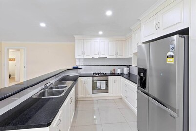 Comfortable 4-Bedroom Home with Backyard Escape