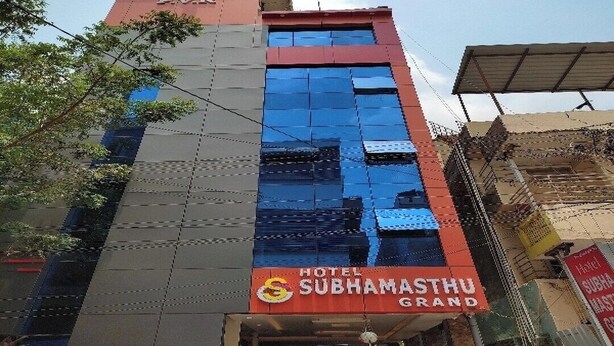 A hotel with a modern facade, featuring a prominent sign for 'Hotel Subhamsathu Grand'. - SRI SUBHAMASTHU GRAND (Vijayawada)