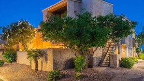A modern building with a prominent tower, a staircase, and a well-maintained garden. - Starlight Escape - Heated Pool & Spa by Old Town! (Scottsdale)