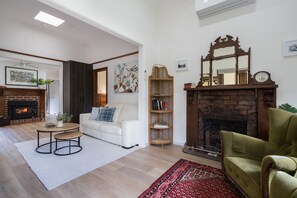 TV, fireplace, books