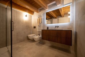 Shower, free toiletries, hair dryer, slippers