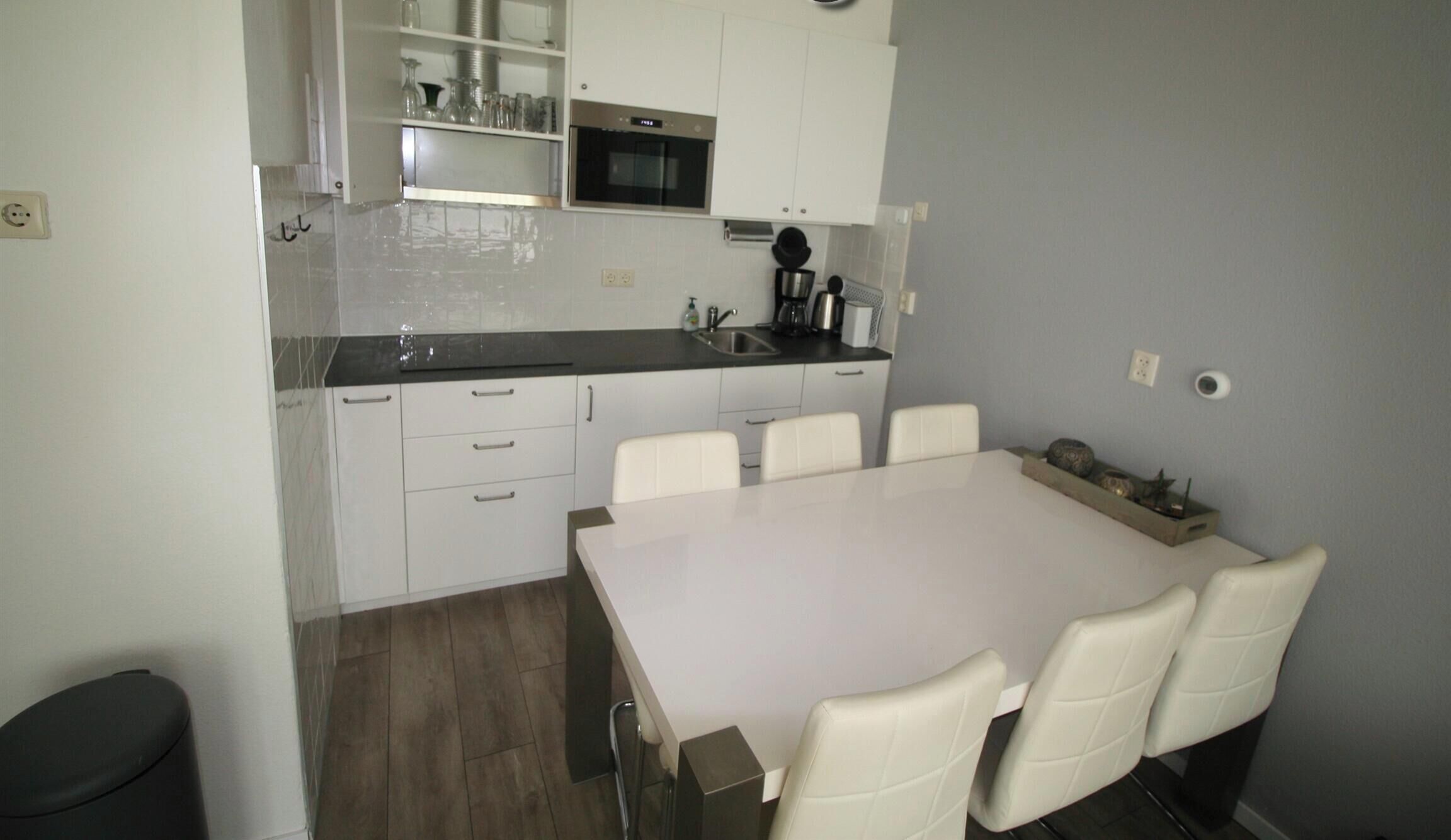 Fridge, stovetop, dishwasher, coffee/tea maker