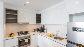 Luxury Apartment, Balcony, City View | Private kitchen | Full-size fridge, microwave, oven, stovetop